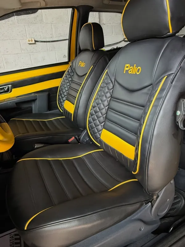 Fiat Palio, negro y amarillo, en Monster Garage Vzla, Valencia